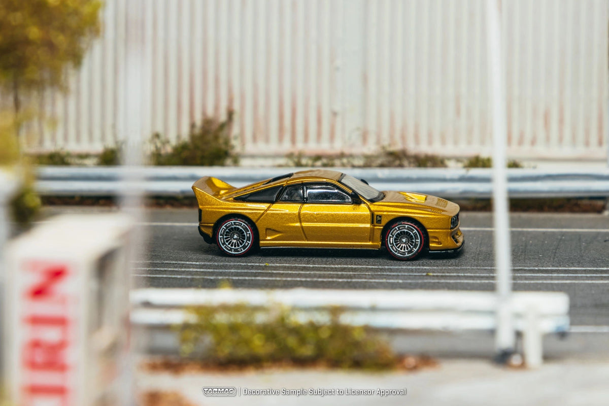 **PRE-ORDER** TARMAC - 1:64 KIMERA EVO38 GOLD 2026